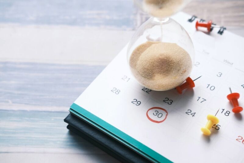 hourglass on a calendar illustrating a startup marketing timeline for healthcare practices from Clear to Launch Healthcare Marketing