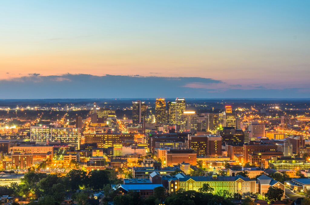 Downtown Birmingham, AL skyline illuminated at night, showcasing the vibrant and effective dental marketing solutions of Clear to Launch Dental Marketing for Birmingham's dental practices.