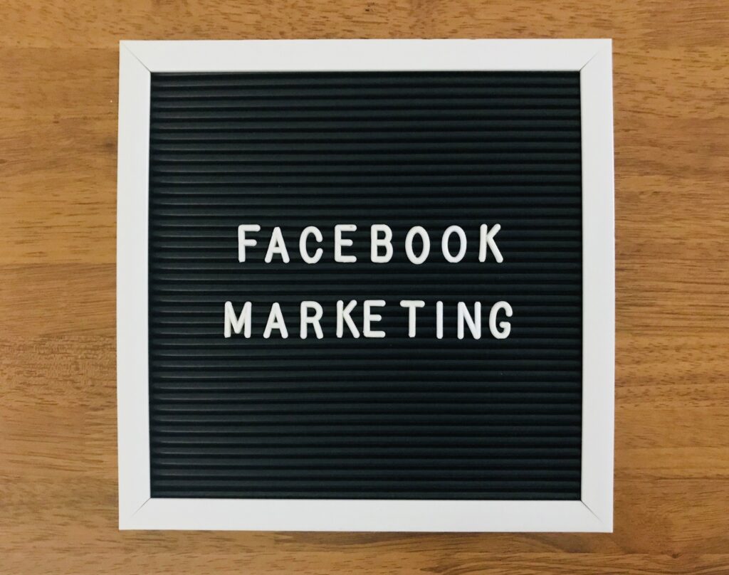 Letter board displaying 'Facebook Marketing' on a wood background, representing Facebook ads strategy for Healthcare practices with Clear to Launch Healthcare Marketing.
