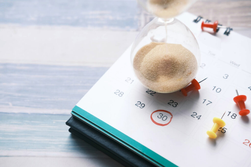hourglass on a calendar illustrating a startup marketing timeline for healthcare practices from Clear to Launch Healthcare Marketing